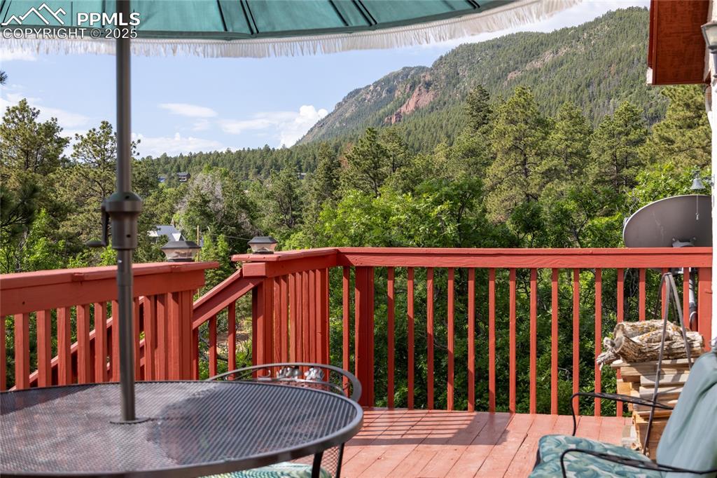 Image 11 of 38: Stunning views from the deck off of the kitchen and main-level bedroom