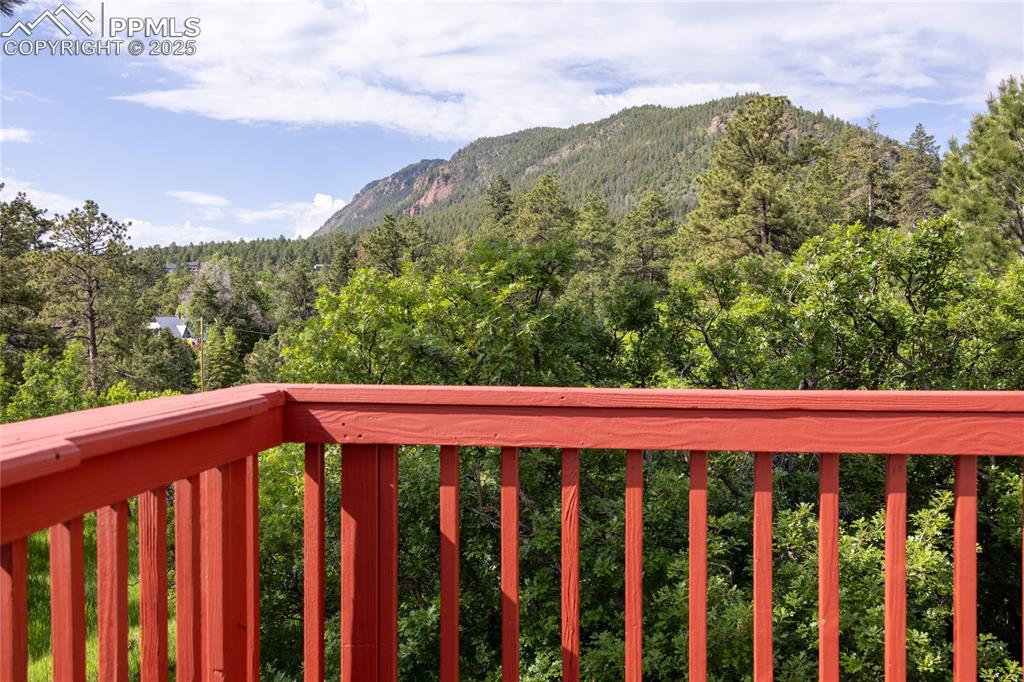 Image 12 of 38: Stunning views from the deck off of the kitchen and main-level bedroom