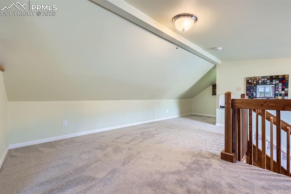Image 22 of 38: Upper level loft/master bedroom