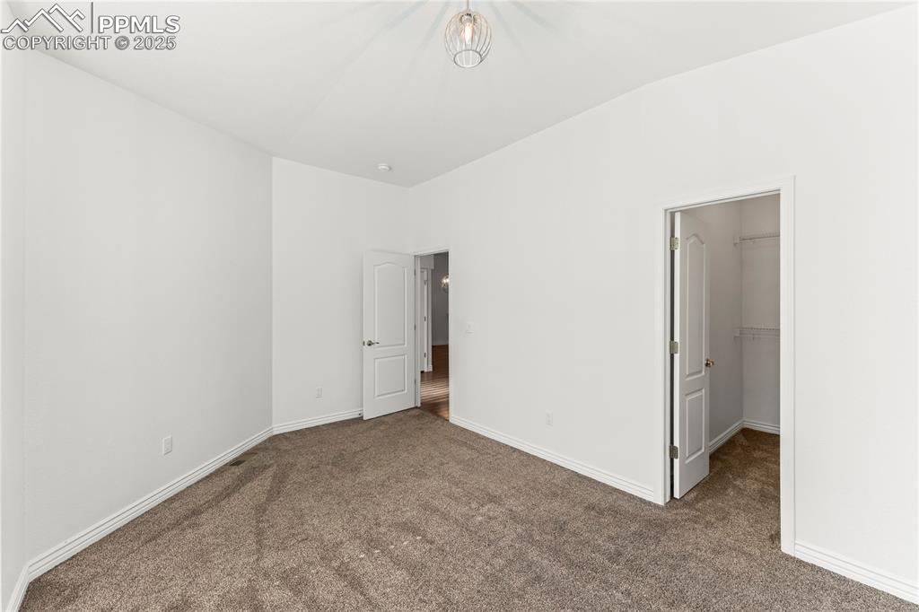 Image 15 of 50: Bedroom with walk in closet