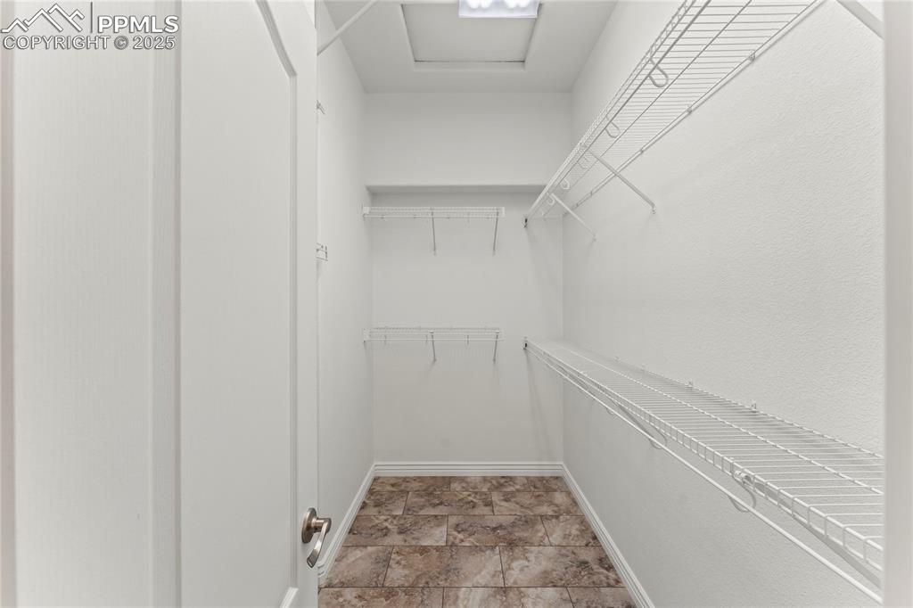 Image 22 of 50: View of spacious walk in closet