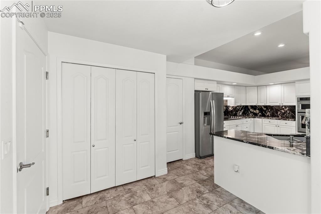 Image 27 of 50: Dining area with access to laundry