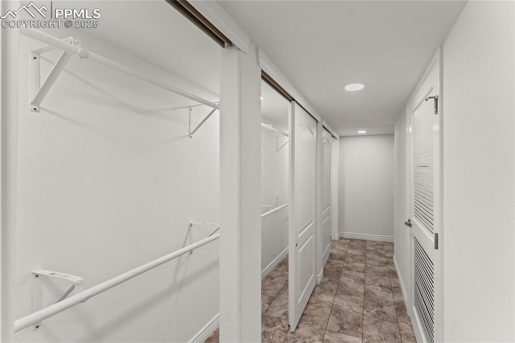 Image 44 of 50: Spacious closet featuring tile flooring