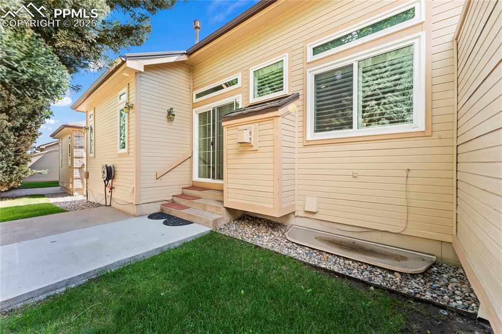 Image 47 of 50: Rear view of property featuring entry steps and a patio area