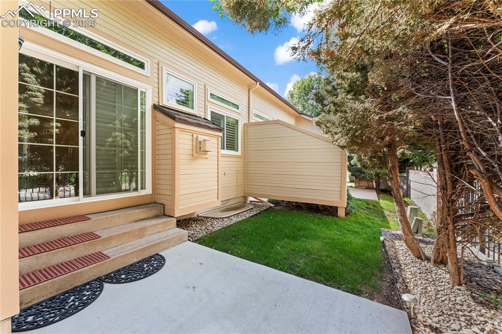 Image 48 of 50: View of yard featuring a patio and entry steps