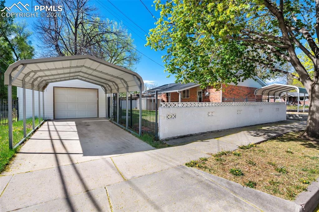 Image 35 of 41: Carport and Detached Garage