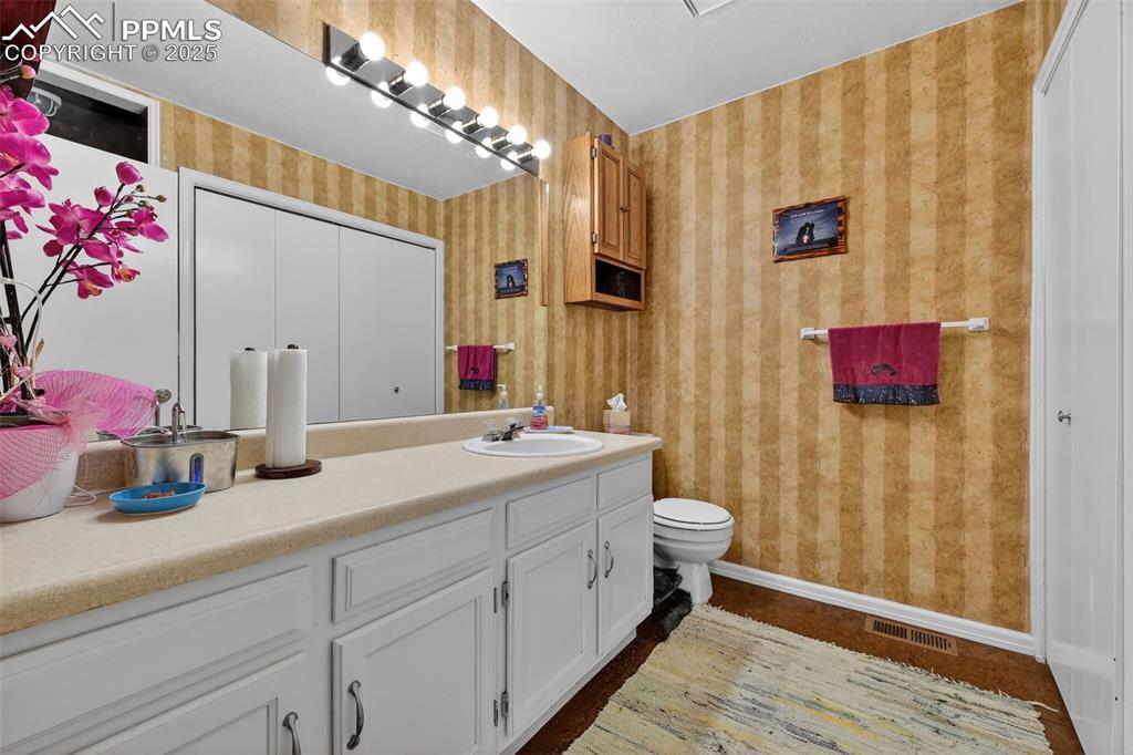 Image 15 of 27: Main half bath is spacious.