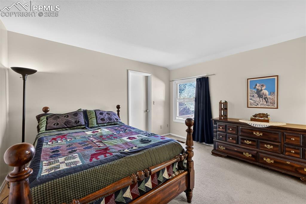 Image 21 of 27: Primary bedroom has walk in closet and attached bath.