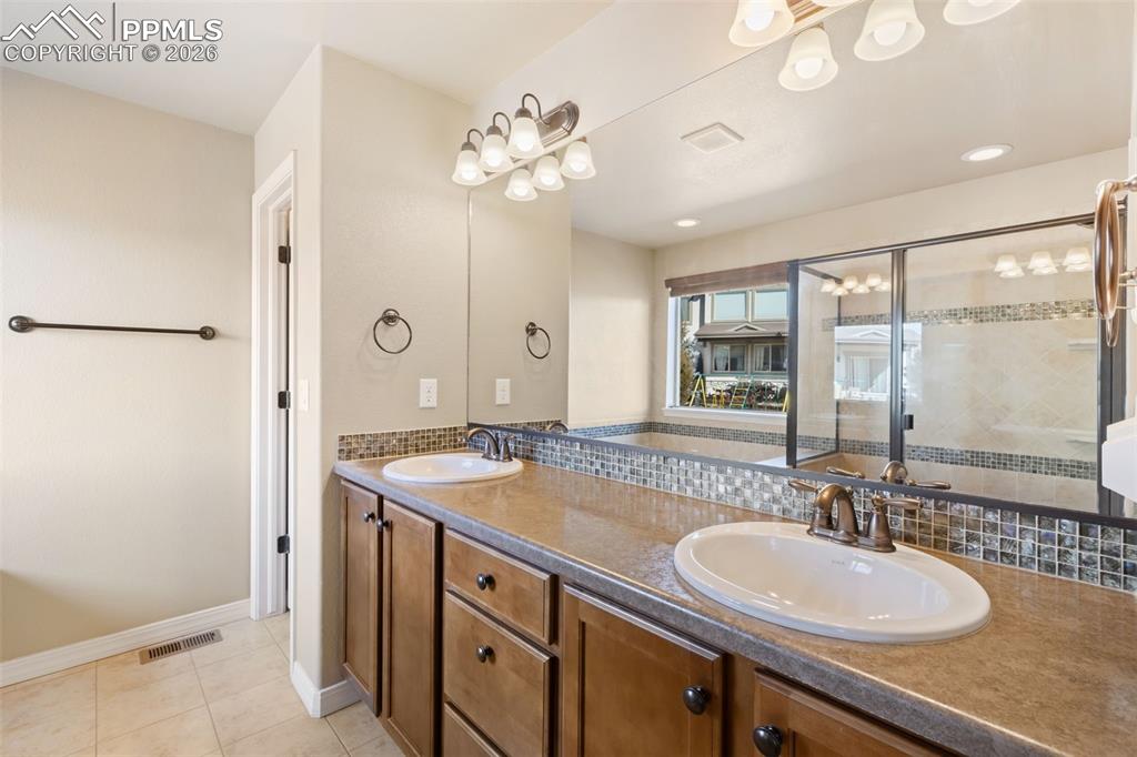 Image 14 of 36: Luxurious Primary Bathroom with Dual Vanities!