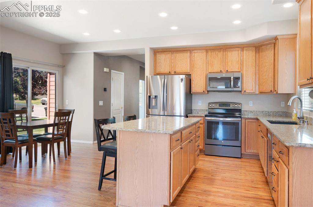 Image 17 of 46: Dining space featuring baseboards and light wood-type flooring