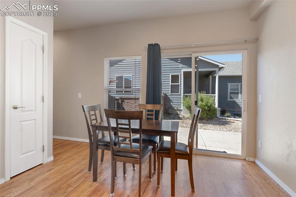 Image 19 of 46: Unfurnished living room featuring light wood-style floors, a tiled fireplac