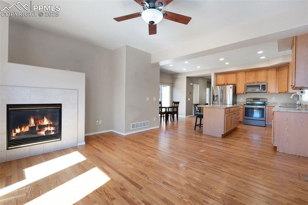Image 22 of 46: Unfurnished bedroom with a walk in closet, light colored carpet, a raised c