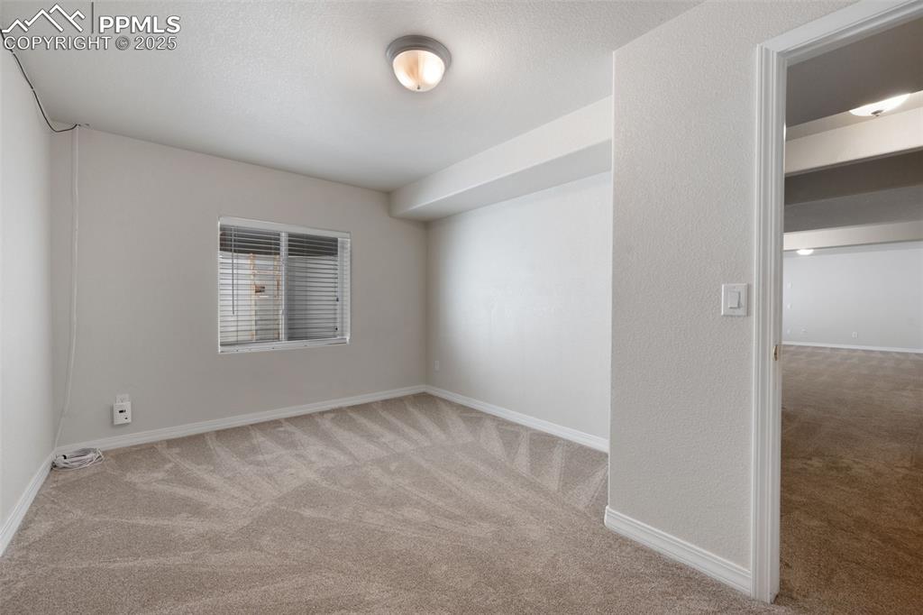 Image 43 of 46: Full bath with shower / bath combination with curtain, vanity, and light ti