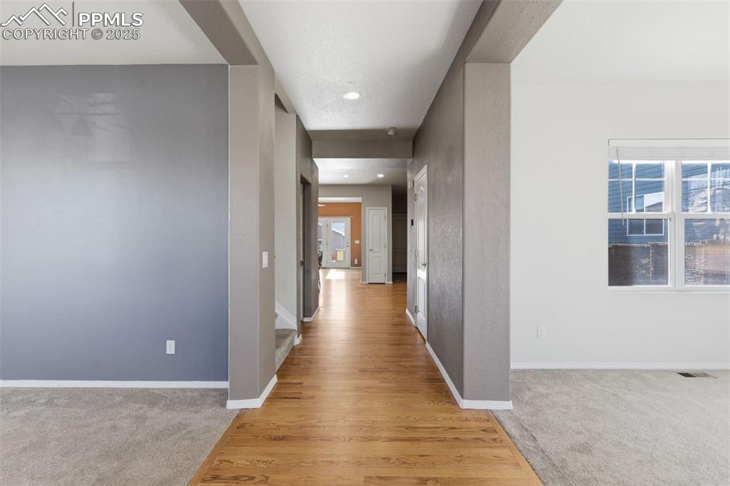 Image 8 of 46: Spare room featuring carpet flooring, a chandelier, recessed lighting, and