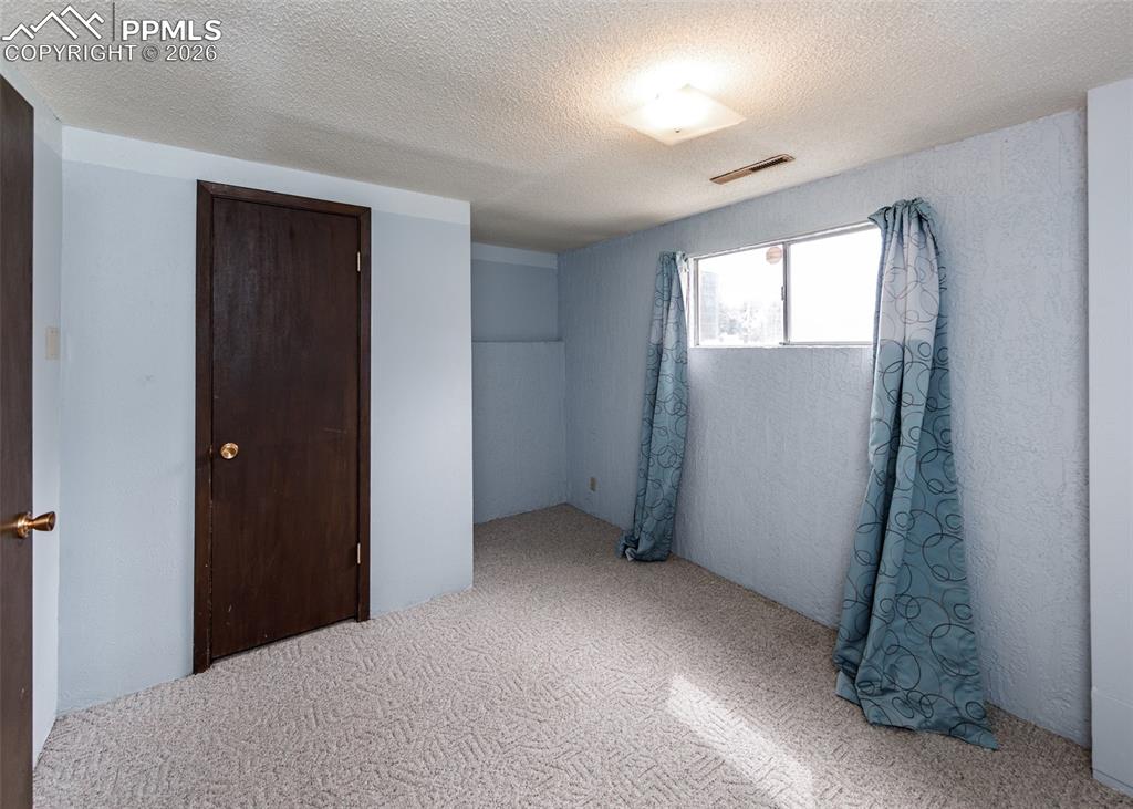 Image 30 of 41: Basement Bedroom