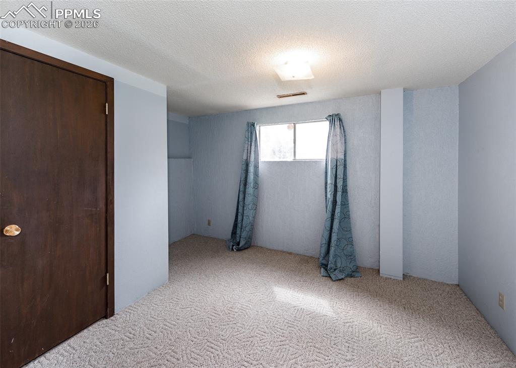 Image 31 of 41: Basement Bedroom