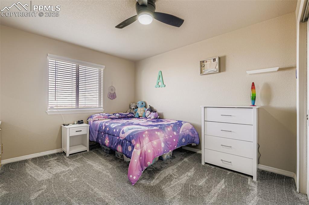 Image 18 of 35: Bedroom featuring carpet floors and a ceiling fan