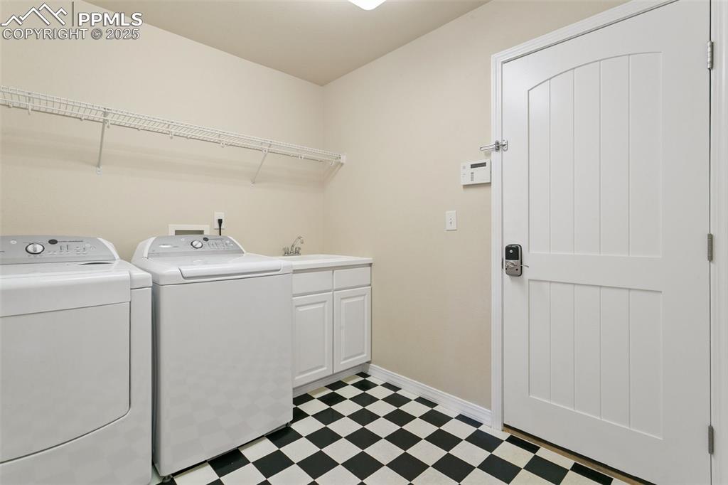 Image 16 of 37: Laundry room featuring independent washer and dryer and light flooring