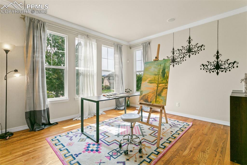 Image 8 of 37: Home office featuring ornamental molding and light wood-type flooring
