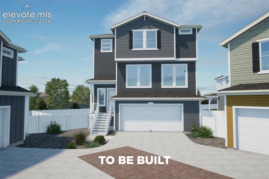 Image 1 of 31: Contemporary three-story residence featuring dark siding, white trim, and a