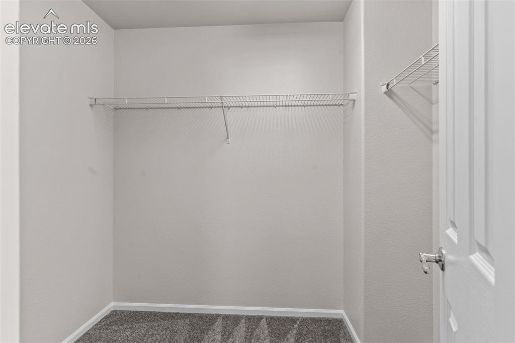 Image 21 of 33: Spacious walk in closet in the primary bedroom