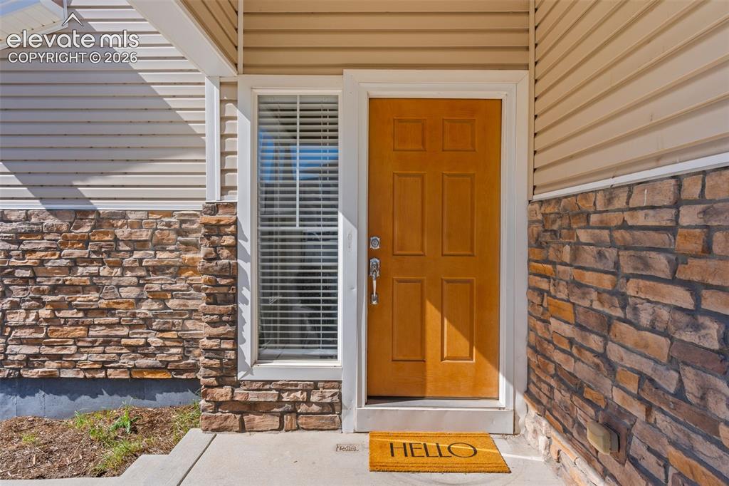 Image 3 of 33: Inviting front patio