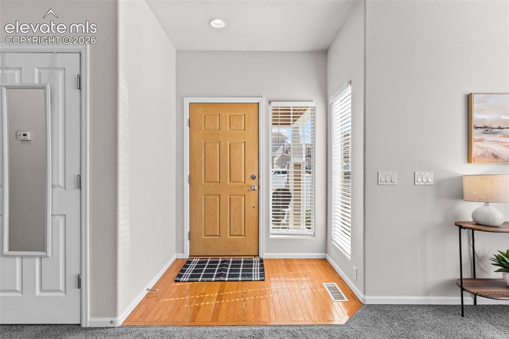 Image 4 of 33: Hardwood floors greet you