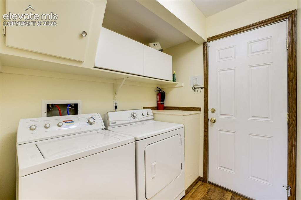 Image 34 of 38: Laundry on the lower level & garage entrance. 