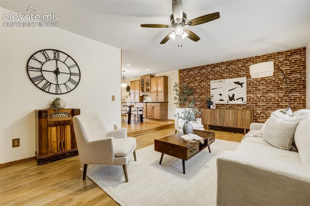 Image 6 of 38: Natural light, oak floors, and enough charm to make your furniture look mor