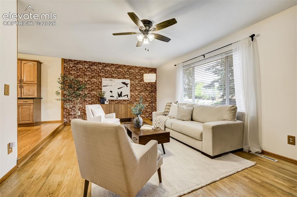 Image 7 of 38: A living room that says, “Come in and stay awhile."