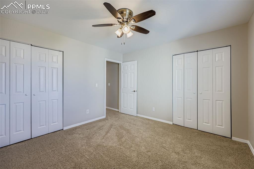 Image 15 of 24: Front Bedroom with Multiple Closets