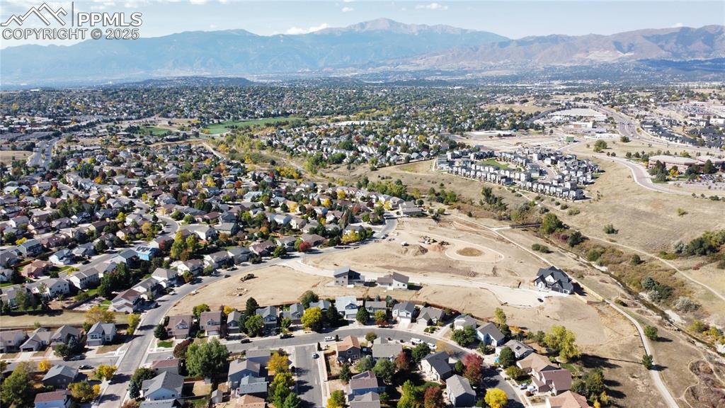 Image 2 of 2: Birds eye view of property with a mountain view