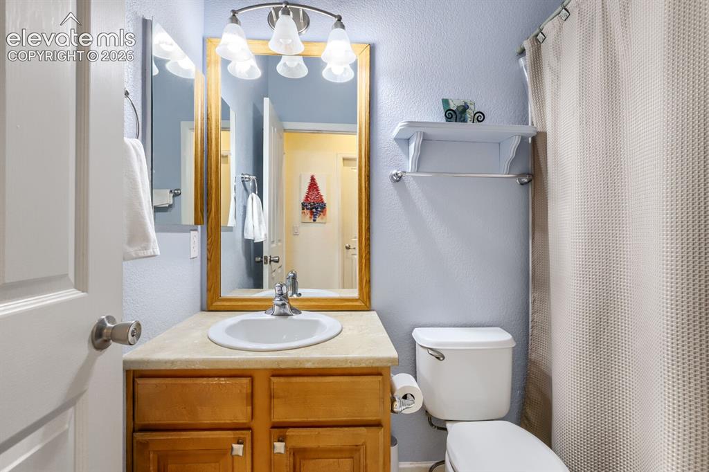Image 12 of 23: Main level full bathroom.