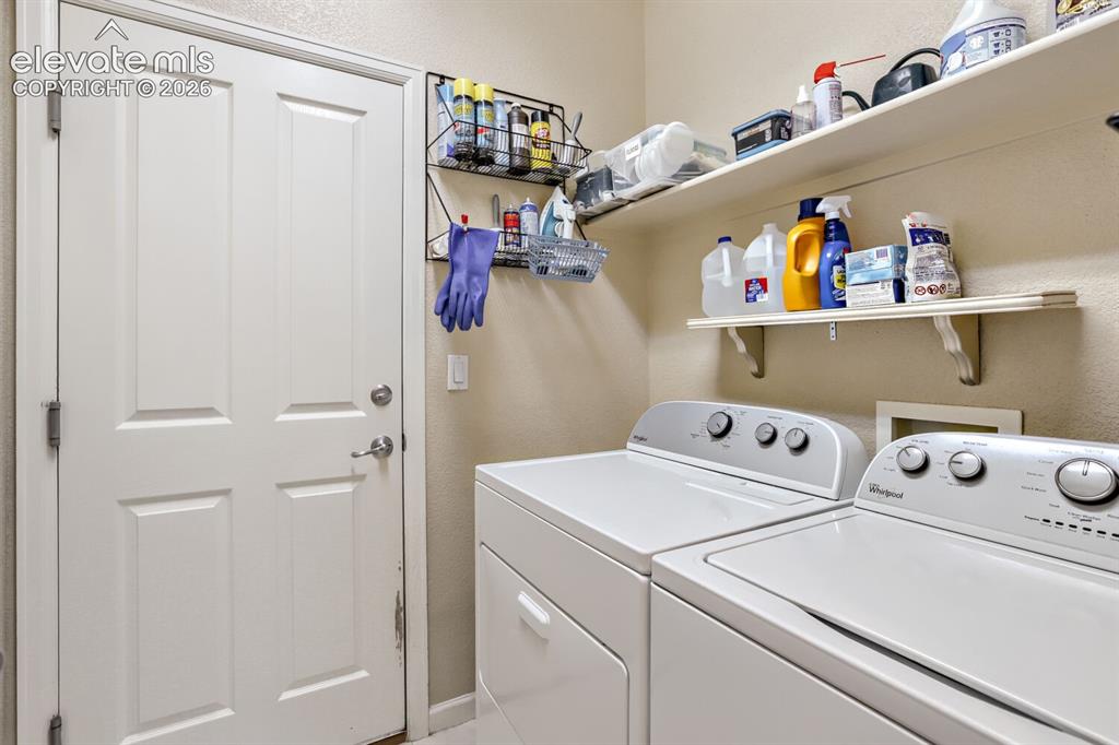 Image 13 of 23: Main level laundry off of garage.