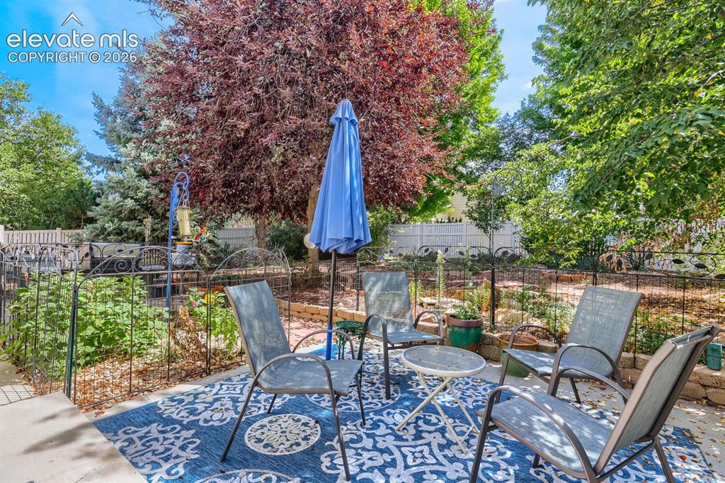 Image 15 of 23: Enjoy relaxing, evenings, and entertaining on the back patio.
