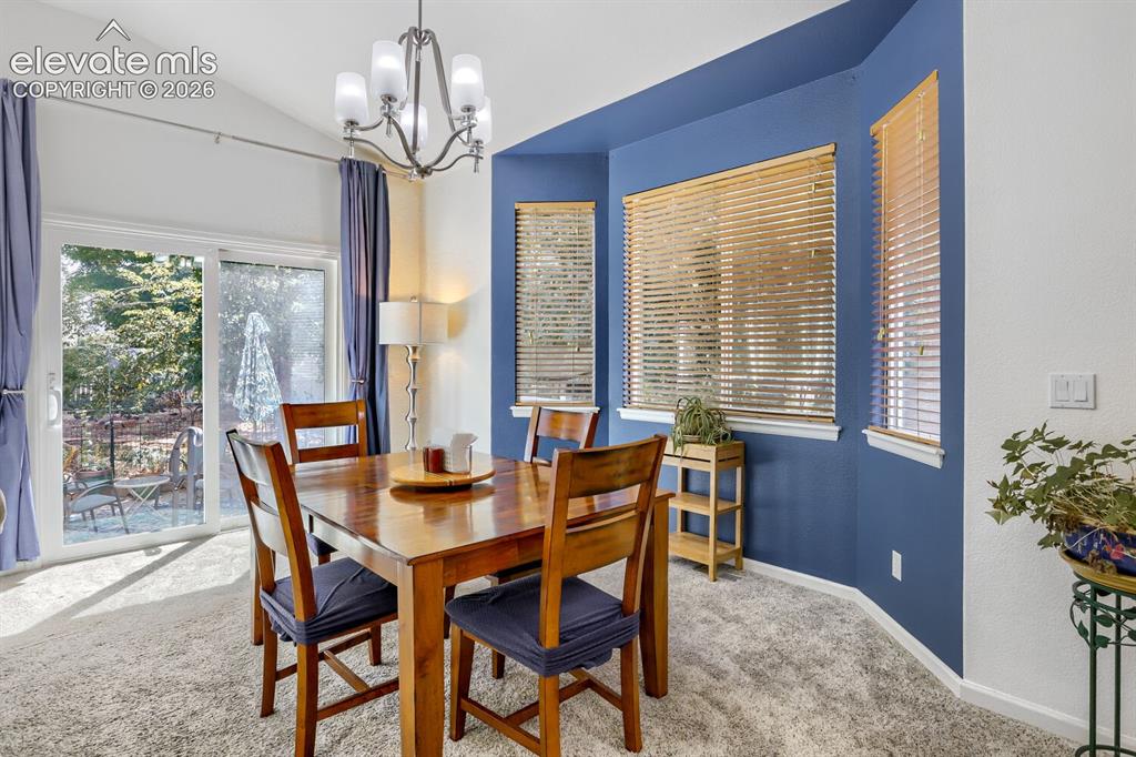 Image 4 of 23: The dining area is off of the kitchen and Great room with a walk out to the