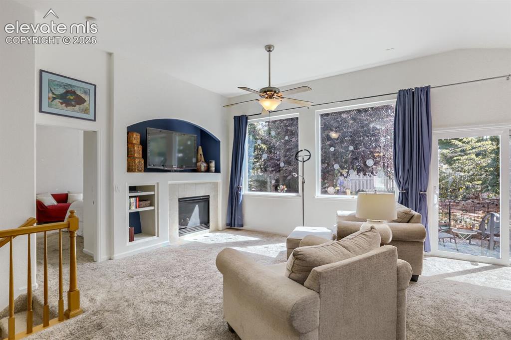 Image 5 of 23: The Vaulted Great Room has a gas fireplace and upgraded large picture windo