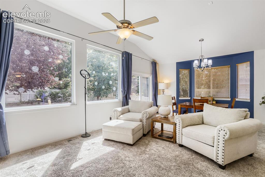 Image 6 of 23: Natural light and a lovely view of the landscaped backyard from the upgrade