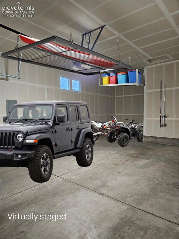 Image 22 of 37: Spacious garage for all your adventure toys - virtually staged
