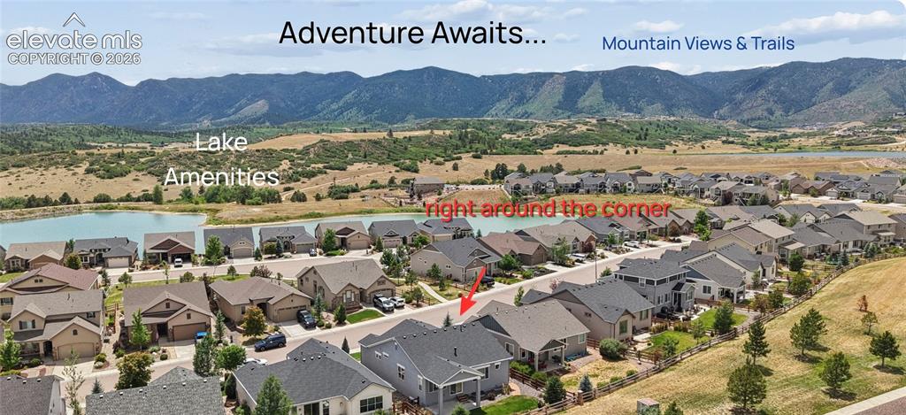 Image 26 of 37: Aerial perspective showcasing a residential neighborhood with distant mount