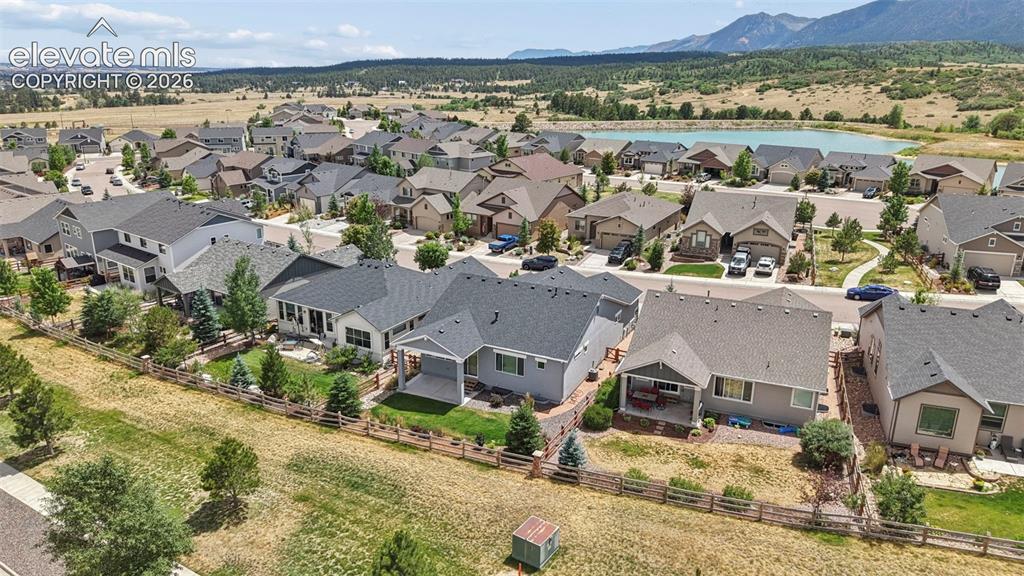 Image 27 of 37: Sprawling residential development featuring a collection of single-family h