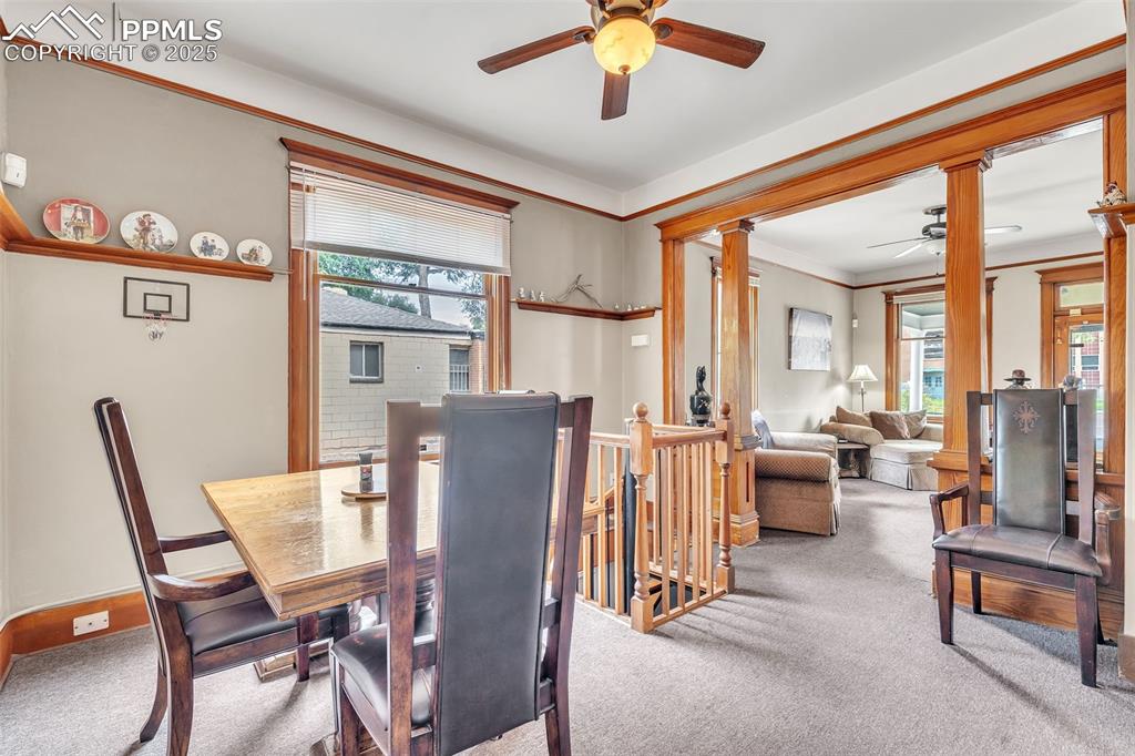 Image 13 of 49: Dining space with ceiling fan, healthy amount of natural light, carpet, and