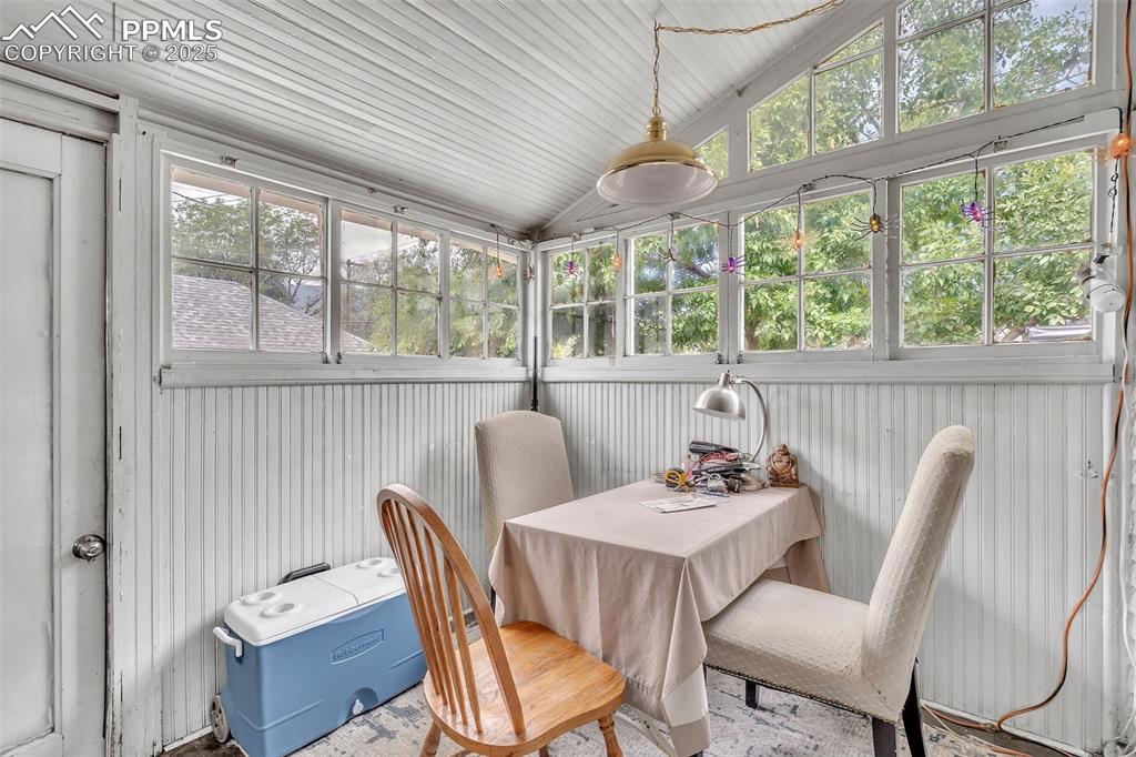 Image 20 of 49: Sunroom / solarium with lofted ceiling