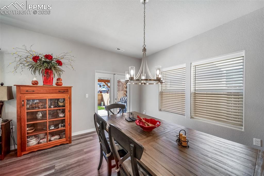 Image 18 of 45: Dining room with chandelier 