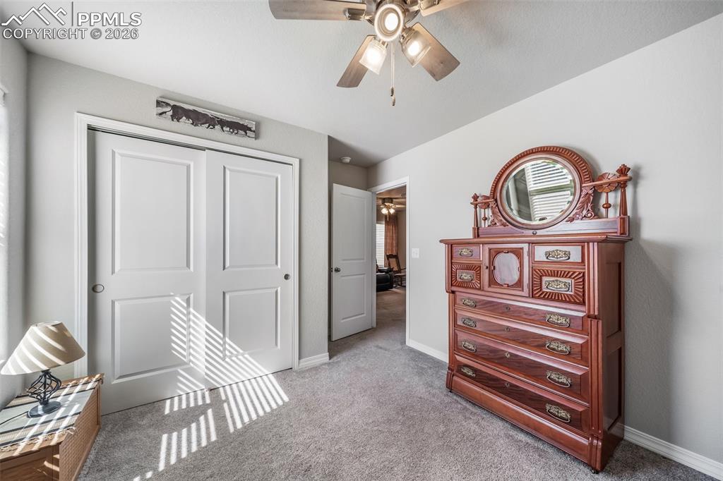 Image 33 of 45: Ceiling fan in the second upstairs bedroom. Don