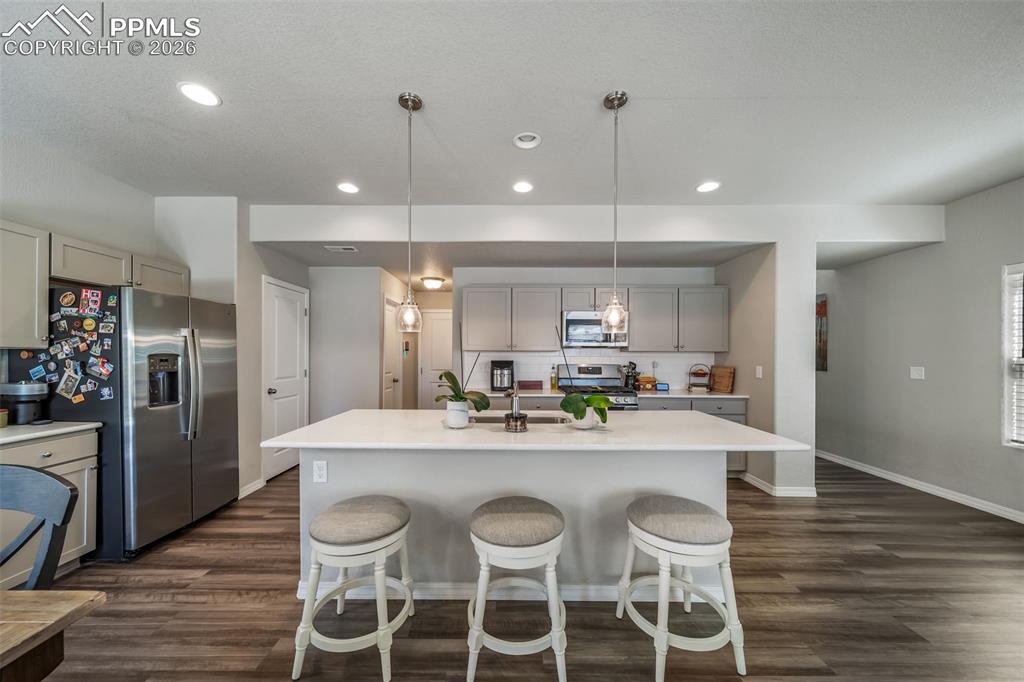 Image 6 of 45: Open concept kitchen with eat in island.