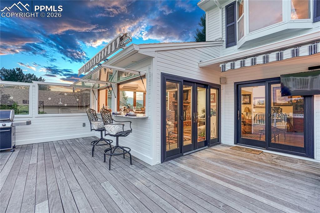 Image 17 of 44: Expansive outdoor deck featuring wood-finish flooring