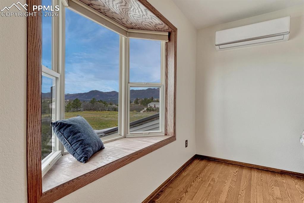 Image 26 of 44: Bay window with wood-finish trim and integrated window seat