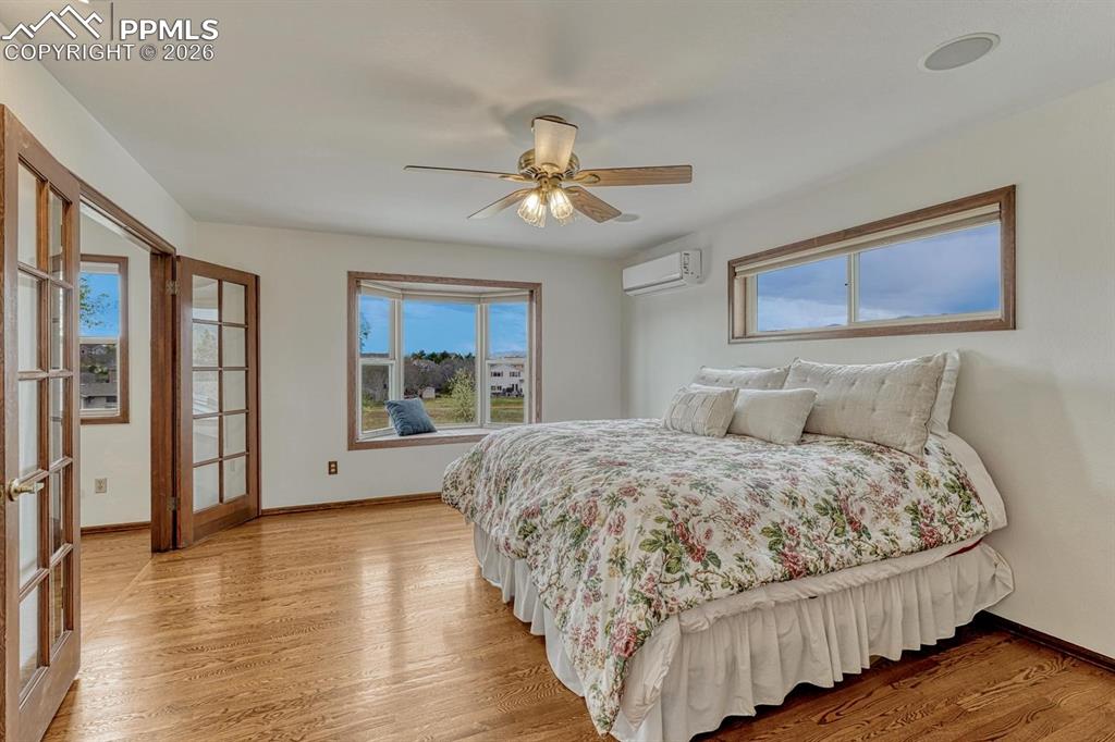 Image 27 of 44: Hardwood flooring extending throughout, featuring a bay window with integra