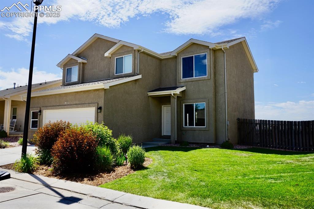 Caption: Traditional home featuring stucco siding